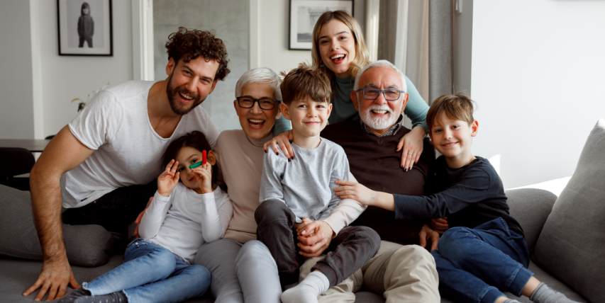 A family photo with grandparents, parents, and children.